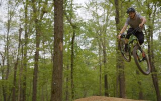 Mountain Biker jumping a trail at Coler