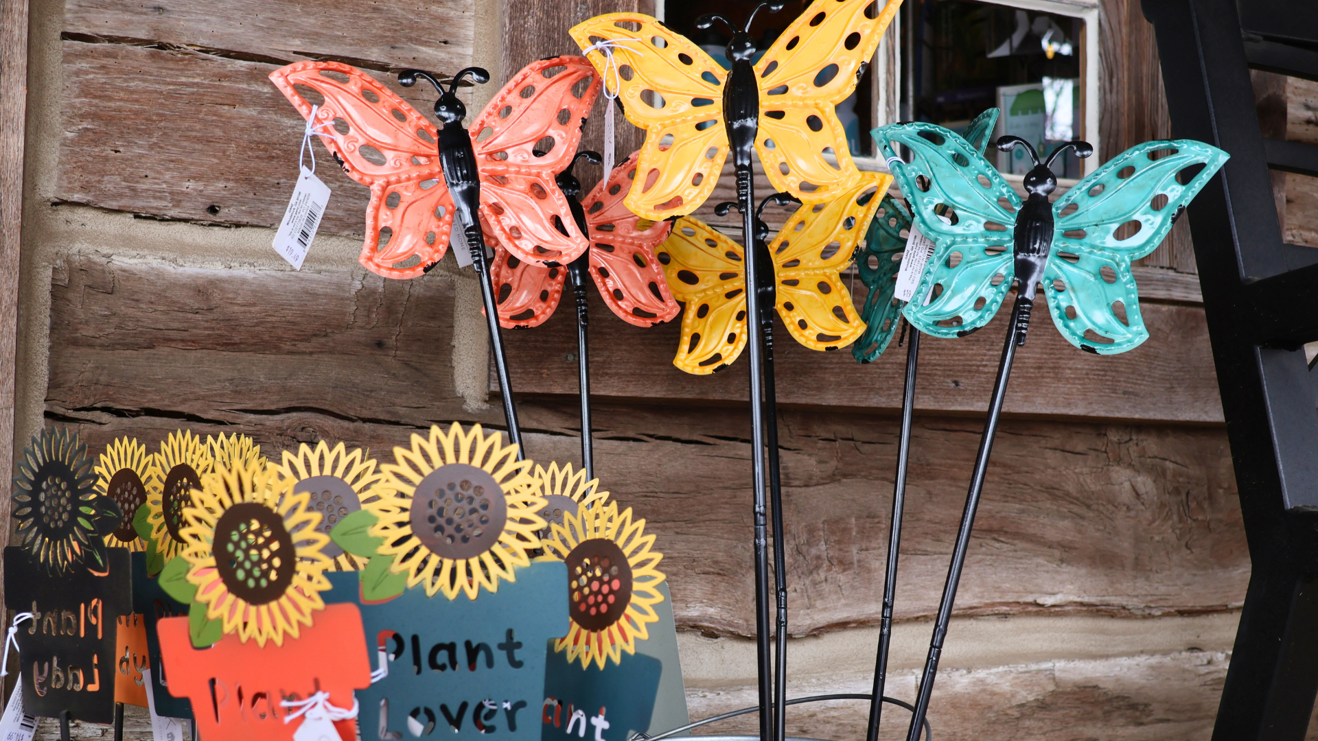 Sunflower and Butterfly garden stakes in colors of yellow, orange, and blue