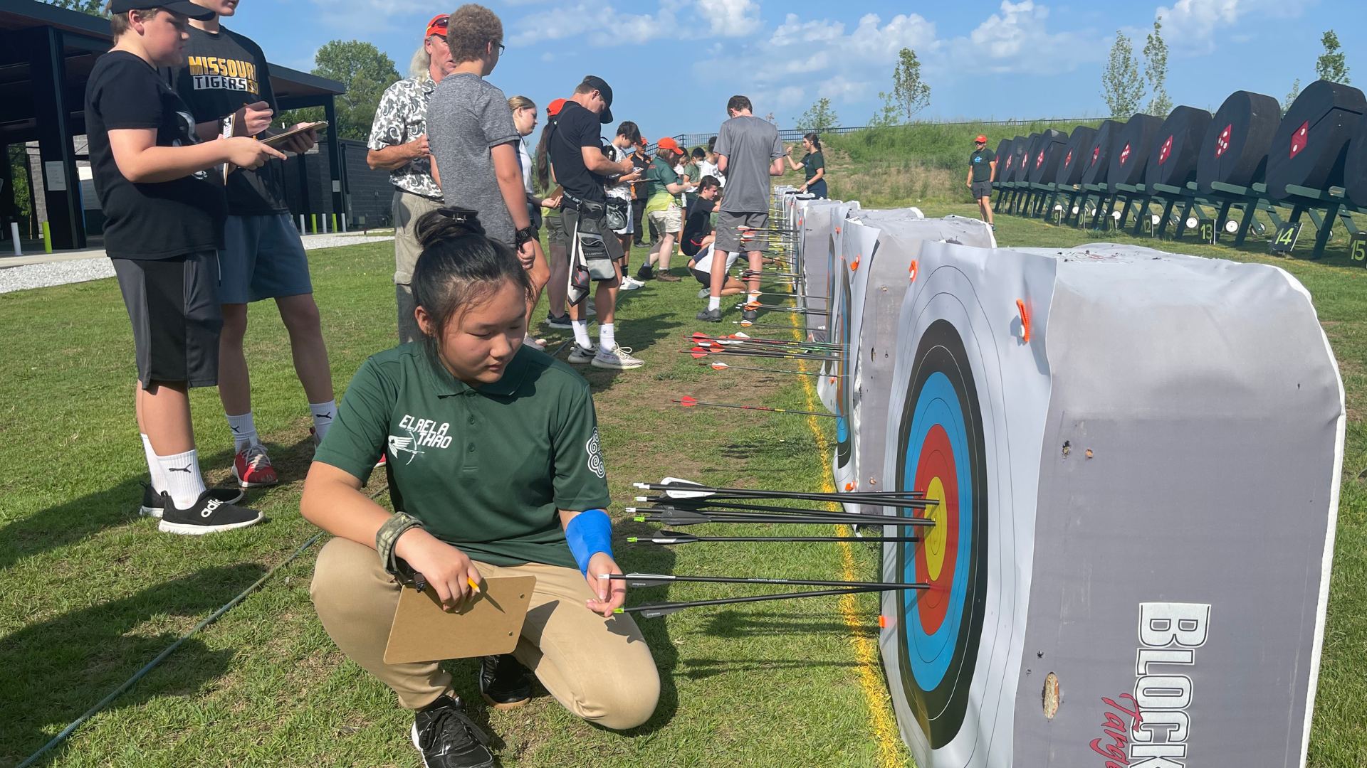 kids scoring their archery shots on targets at The Quiver Archery Range