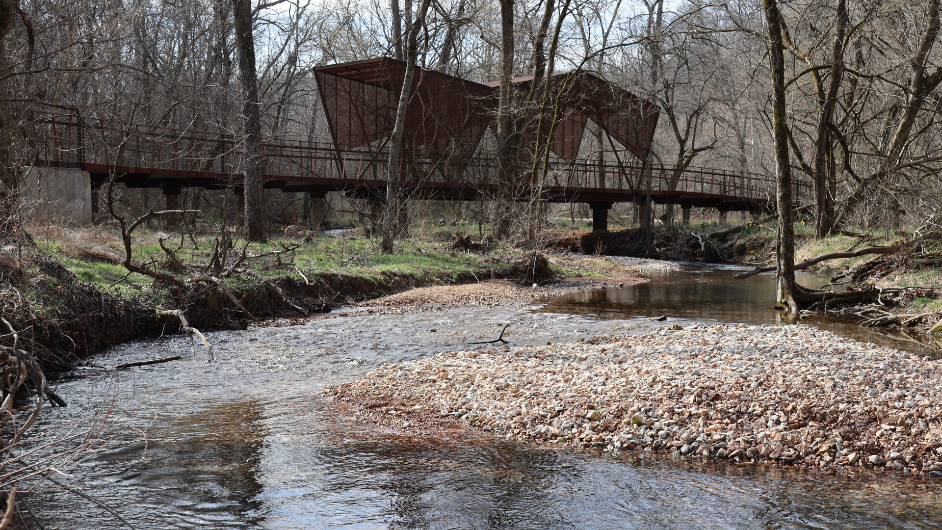 image of one of the iron bridges at Coler over a creek in the springtime