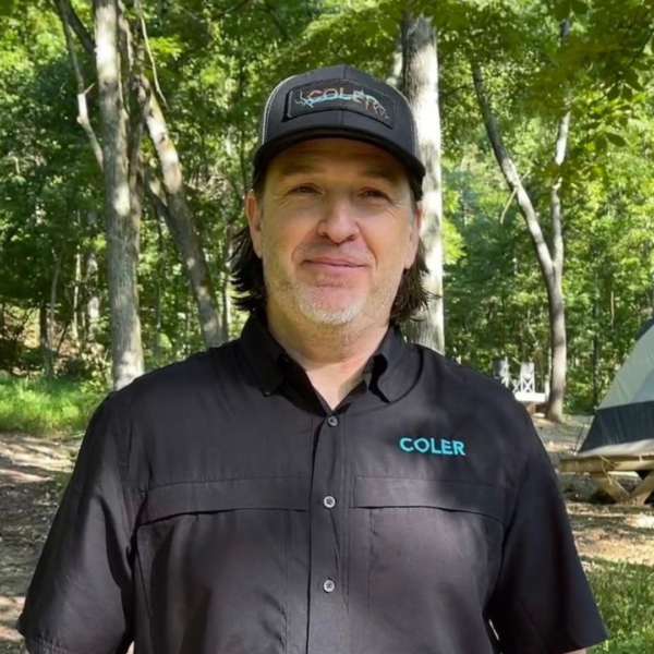 Photo of Ben, the Campground Manager at Coler, at the campground in the summertime